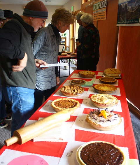 Bidders looking at the pies to bid on at Pie day